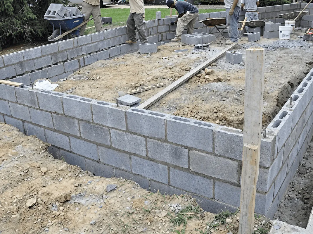Professionals building a foundation with blocks in Newark, NJ