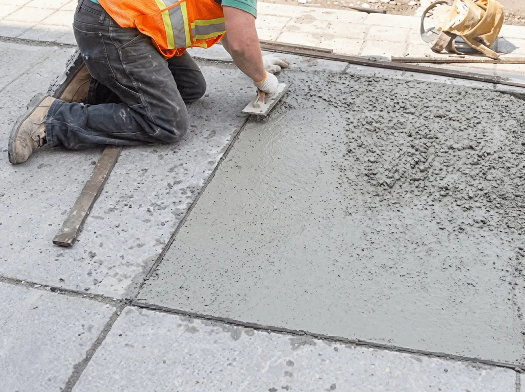 Professional repairing a concrete floor in Newark, NJ